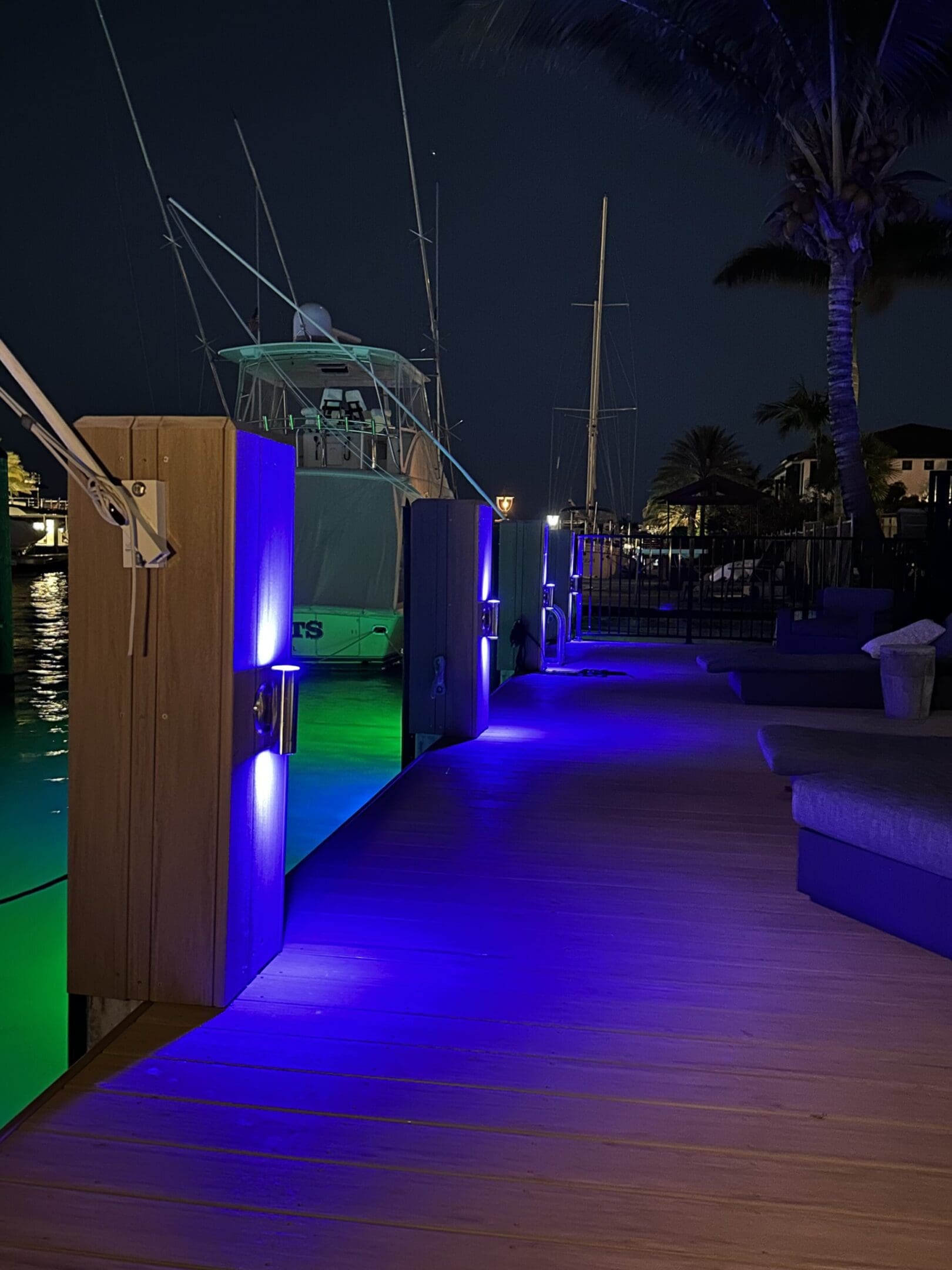 A deck with lights and benches on it