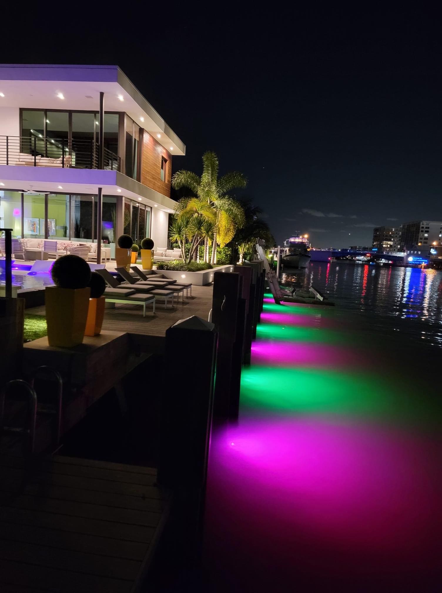 A row of colorful lights on the side of a building.